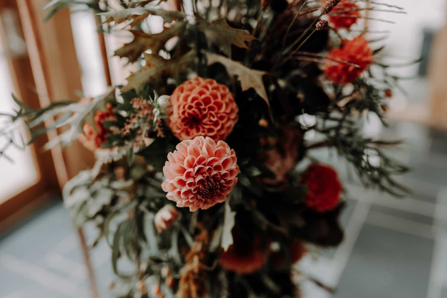 An arrangement of flowers with Dahlias